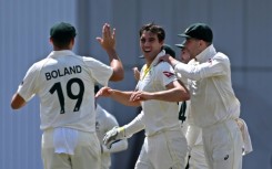 Leading from the front - Australia captain Pat Cummins (C) celebrates with team-mates after dismissing England's Moeen Ali in the third Ashes Test at Headingley