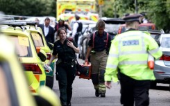 Two remain in critical condition after a car crashed into the building of a London primary school, leaving an eight-year-old girl dead