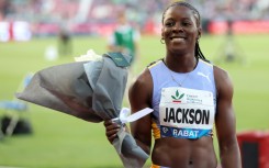 Shericka Jackson won the women's 100m title at the Jamaican Athletics Championships in a personal best of 10.65 seconds, the fastest time in the world this year