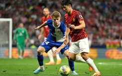 South Korean forward Lee Kang-in (R) has signed for PSG