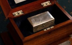 The wooden trophy holds a silver razor case carried during the 1915 Gallipoli landing in World War I