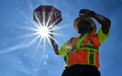 A traffic warden in Las Vegas mans his street corner in searing heat in Las Vegas, Nevada