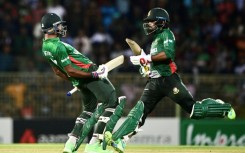 Bangladesh's Towhid Hridoy (R) and Shoriful Islam (L) celebrate after winning the first T20 international against Afghanistan