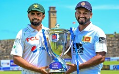 Pakistan captain Babar Azam (left) with his Sri Lankan counterpart Dimuth Karunaratne at the Galle International Cricket Stadium