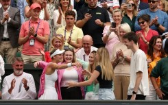 Marketa Vondrousova (L) celebrates with her family at Wimbledon