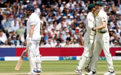 Flashpoint: Australia captain Pat Cummins (R) and wicketkeeper Alex Carey (C) celebrate the stumping of England's Jonnny Bairstow in the second Test at Lord's