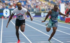 South Africa’s Akani Simbine (R) wins the men's 100m ahead of USA’s Fred Kerley (L)