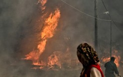 Local residents watch raging wildfires in Greece
