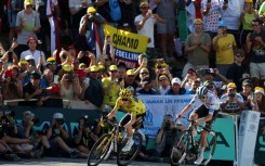 Jonas Vingegaard wearing the overall leader's yellow jersey held off his chief antagonist Tadej Pogacar again on stage 15