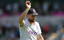 Five-wicket hero - England's Chris Woakes takes the applause of the crowd after his 5-62 against Australia in the fourth Test at Old Trafford