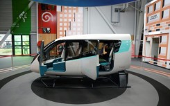 Brazil's Embraer and its subsidiary Eve Air Mobility say they will begin manufacturing electric flying cars, a model cabin of which is seen here at a Paris air show in June 2023, at a factory near Sao Paulo as early as 2026