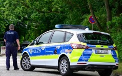 Police continued combing the streets of suburban communities southwest of Berlin in the small hours of Friday using night-vision goggles and drones