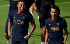 Kylian Mbappe (left) and his younger brother Ethan  at PSG training ahead of the club's Japan tour, which the older brother will now not be joining