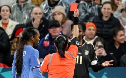 Referee Maria Carvajal shows a red card to Jamaica's forward Khadija Shaw