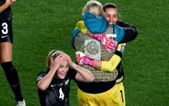 New Zealand defender Catherine Bott (L) celebrates victory over Norway