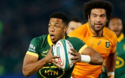 South Africa scrum-half Grant Williams (L) breaks during a Rugby Championship victory over Australia in Pretoria on July 8, 2023.