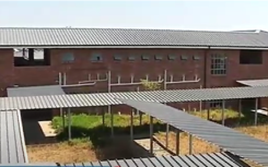 An R82-million school in Tembisa is standing empty while pupils are taught in containers. The Infrastructure Development Department hasn't been able to get a certificate of occupancy because the school was built in a waterlogged area. 