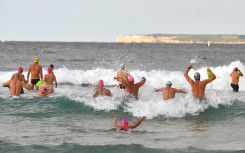 Beachgoers enjoy their first swim after Bondi Beach reopened following a five-week closure in Sydney.