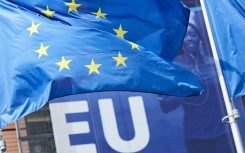 File: The flag of the European Union flying outside the European Commission headquarters in Brussels. AFP/Kenzo Tribouillard