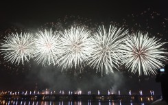 Fireworks light up the sky over the General de Gaulle bridge and the Ebrie lagoon during New Year's celebrations in Abidjan.
