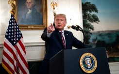 FILE: US President Donald Trump explained that he wanted to avoid causing panic.