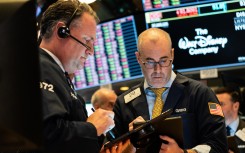 The greenback held gains against most currencies after a blowout in swap spreads showed investors are facing a shortage of dollars as equity markets plunged on fears about the economic impact of the flu-like virus.