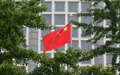 File: The Chinese national flag flies outside the Ministry of Foreign Affairs in Beijing on July 26, 2023. 