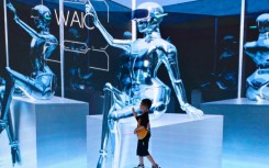 A child visits the World Artificial Intelligence Conference (WAIC) in Shanghai. AFP/Wang Zhao