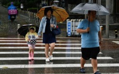 Hundreds of millions of people in northern China, including Beijing, remain under a red alert for heavy rain