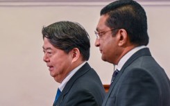 Japan pressed bankrupt Sri Lanka on Saturday to expedite its debt restructuring, including with its biggest creditor China