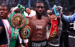 Terence Crawford celebrates his ninth-round technical knockout victory over Errol Spence for the undisputed welterweight world title