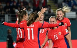 Norway players celebrate the fourth goal in their rout of the Philippines