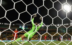 Japan midfielder Hinata Miyazawa scores against Spain