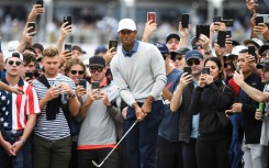 Tiger Woods is joining the PGA Tour's policy board -- a move aimed at cooling tensions over merger talks with the Saudi backers of LIV Golf