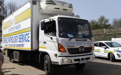 A forensic pathology vehicle arrives at Diepkloof Forensic Laboratory in Soweto carrying victims of the Johannesburg CBD fire. APF/Phill Magakoe