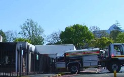 A firetruck next to a torched building in Swellendam.