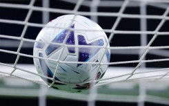 File: A soccer ball hitting a net. AFP/Fabrizio Carabelli/LiveMedia/NurPhoto