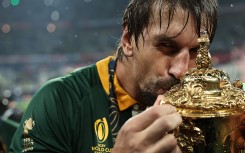 South Africa's lock Eben Etzebeth kisses the Webb Ellis Cup as South Africa's players celebrate winning the France 2023 Rugby World Cup final match against New Zealand at the Stade de France in Saint-Denis, on the outskirts of Paris, on October 28, 2023.