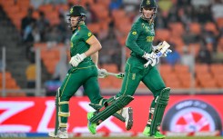 Rassie van der Dussen and David Miller (L) run between the wickets during the 2023 ICC Men's Cricket World Cup ODI match between South Africa and Afghanistan. AFP/Sajjad Hussain