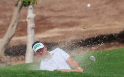 Thriston Lawrence of South Africa plays a shot out of a bunker. AFP/Giuseppe Cacace
