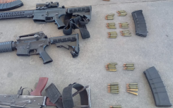 Firearms -- including scores of ammunition and magazines -- were seized. Twitter/@SAPoliceService