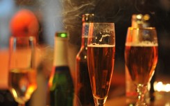 File: Glasses with alcohol on the counter of a bar. Frank May/dpa Picture-Alliance via AFP