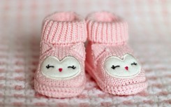 File: Pink baby booties. Terri Cnudde from Pixabay
