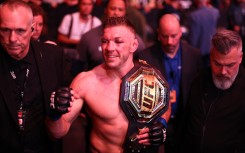 Dricus Du Plessis of South Africa celebrates with the middleweight title belt. AFP/Vaughn Ridley/Getty Images