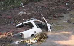 A vehicle that was swept away by the floods.