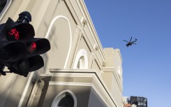 A SANDF helicopter does a fly-over at the Cape Town City Hall. AFP/Marco Longari