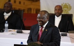 South African President Cyril Ramaphosa reacts as he delivers the state of the nation address at the City Hall in Cape Town on February 8, 2024.