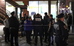 Police are seen at the Mt. Eden Avenue subway station in the Bronx borough of New York after six people were injured with one person in critical condition following a shooting. AFP/Charly Triballeau
