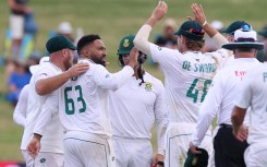 South Africa’s Dane Piedt (L) takes the wicket of New Zealand’s Neil Wagner during day two of the second cricket Test match between New Zealand and South Africa Seddon Park in Hamilton on February 14, 2024.