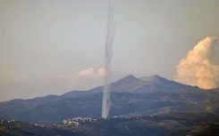 This picture taken from an Israeli position along the border with southern Lebanon shows rockets fired from Lebanon into Israel. AFP/Jalaa Marey